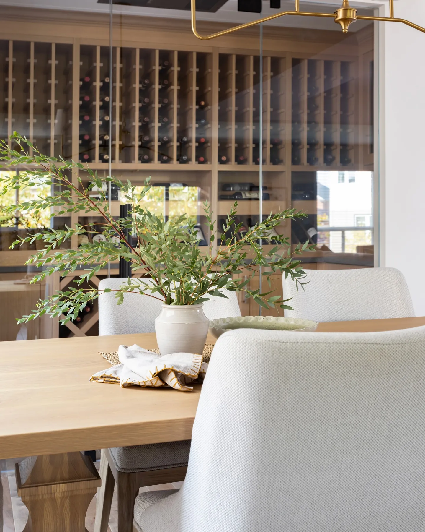 Dining table detail with the wine wall beyond