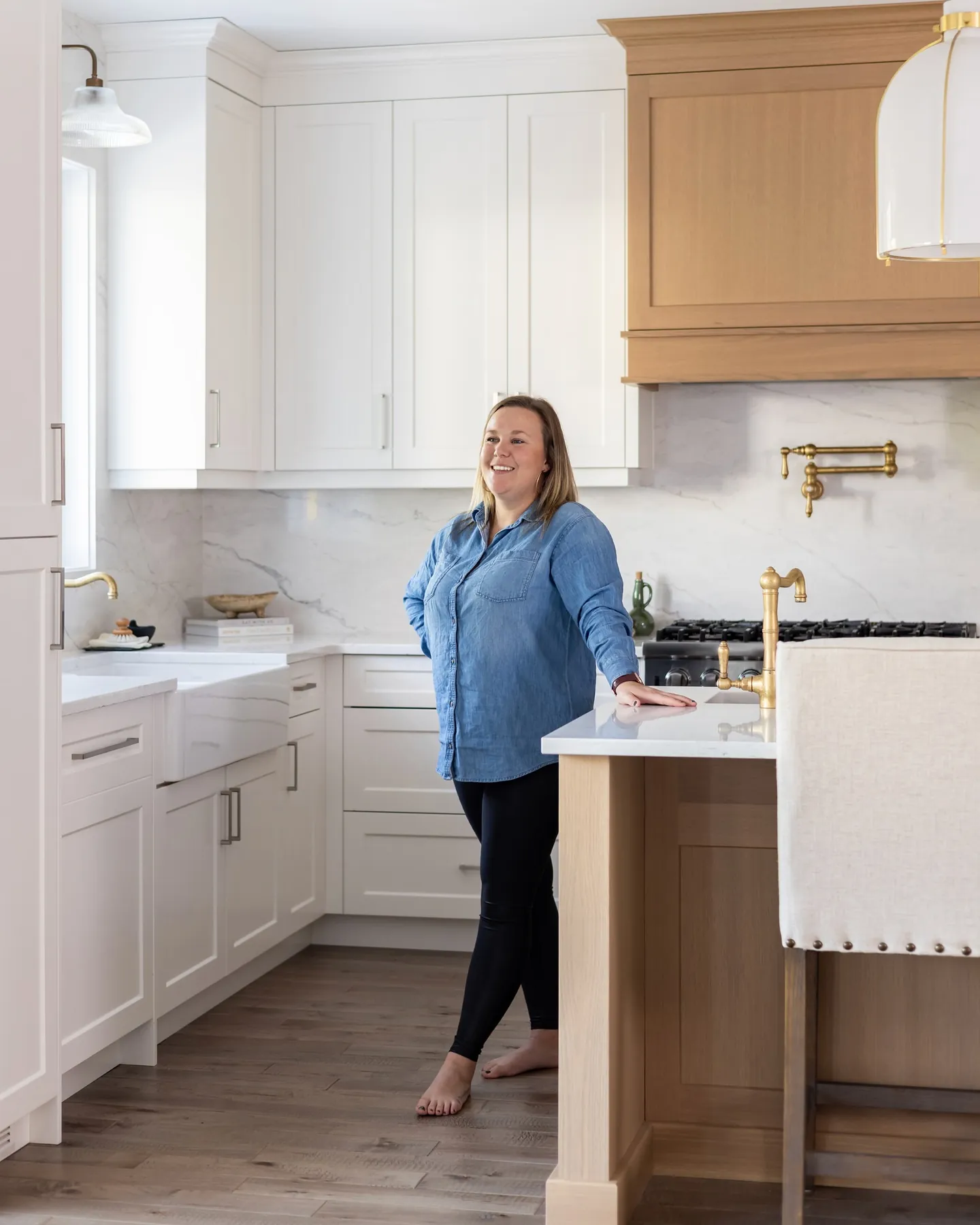 A client in her completed white kitchen