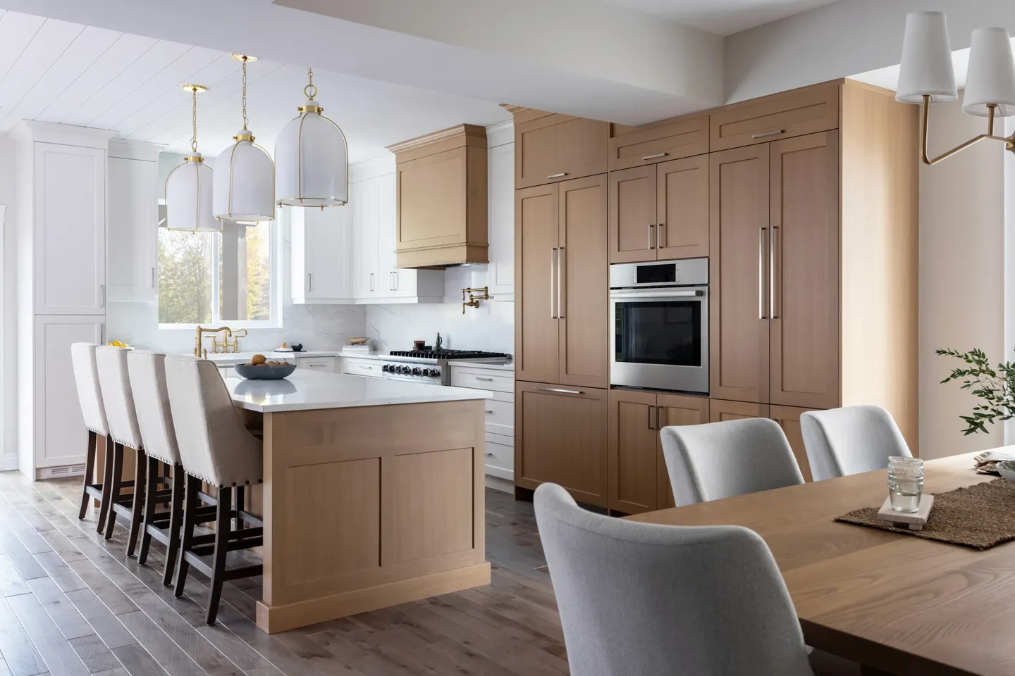 White oak kitchen island and dining chairs in natural light